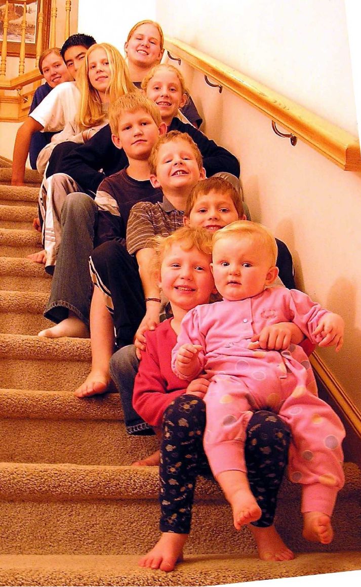 Photo from the 2004 Christmas letter: the King children seated on a staircase