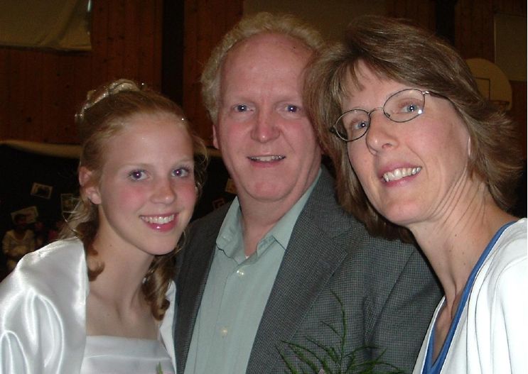 Photo from the 2005 Christmas letter: Sierra in her graduation dress with two family members